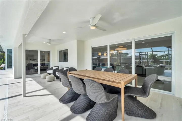 Covered outdoor dining area perfect for al fresco meals and entertaining - Virtually Edited Image