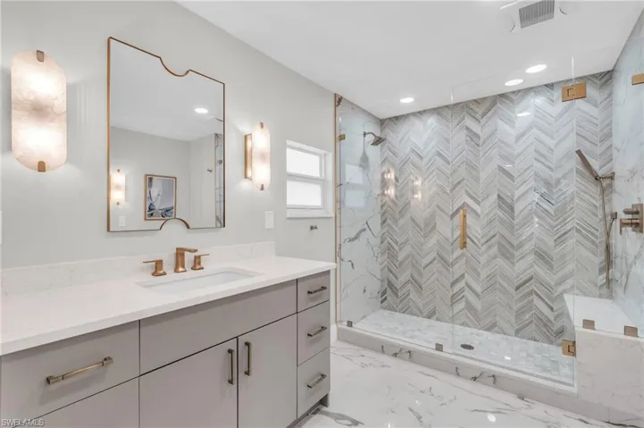 Master #1 Bathroom Modern bathroom featuring a glass-enclosed shower and sleek vanity - Virtually Edited Image