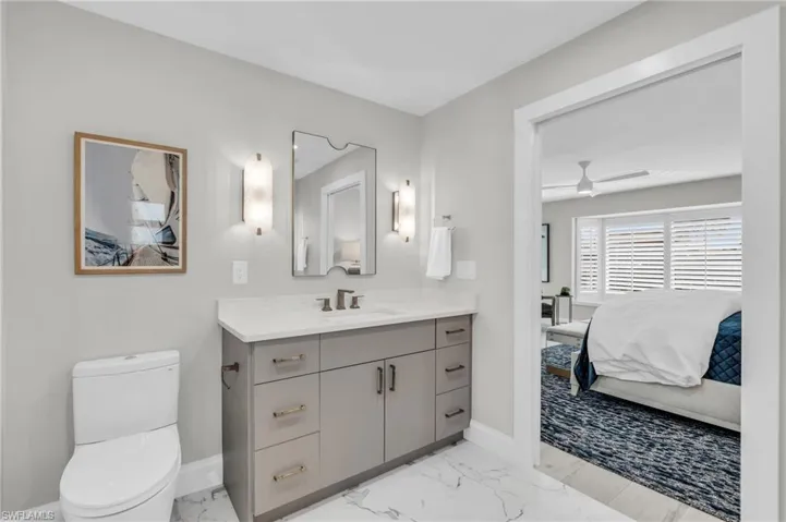 Stylish bathroom with a sleek vanity, updated fixtures - Virtually Edited Image