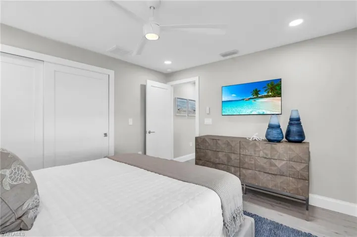 Guest Bedroom #1 Well-lit bedroom with a contemporary and inviting design - Virtually Edited Image