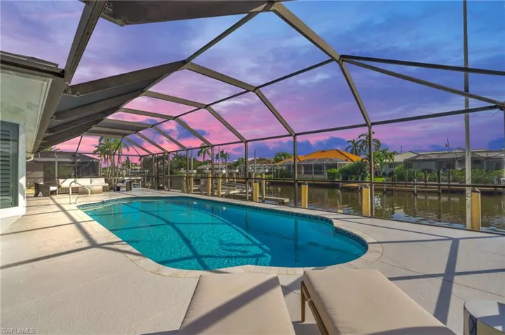 Enjoy evening swims in the private screened pool with stunning sunset views - Virtually Edited Image