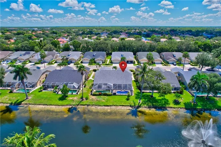 Aerial perspective of suburban area with a large body of water