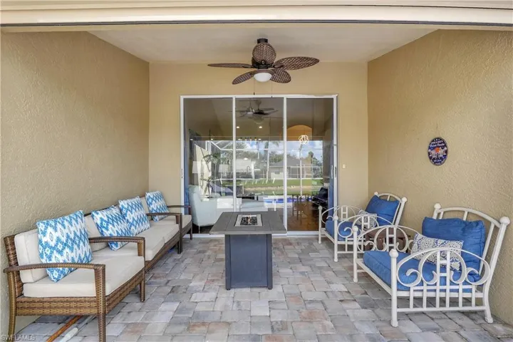 View of patio / terrace featuring an outdoor fire pit and a ceiling fan