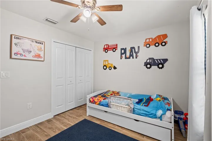 Bedroom with a closet and ceiling fan