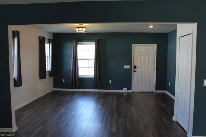 Spare room with dark vinyl flooring
