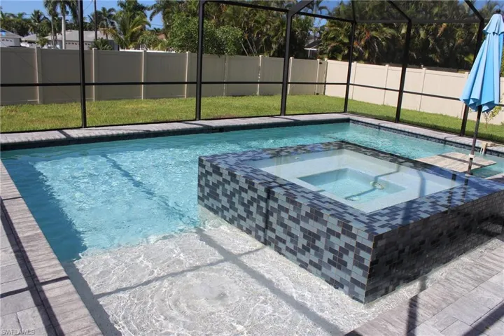 View of pool featuring an in ground hot tub