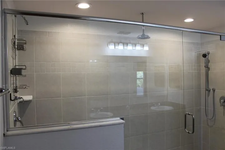 Bathroom with a shower with shower door