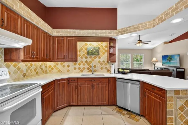 Kitchen featuring NEW Quartz countertops and sink