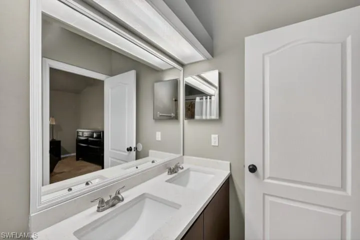 Primary Bathroom with NEW Quartz Countertops (color is soft sage green)