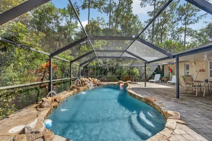 Outdoor lagoon pool with grotto rocks and Fountains!