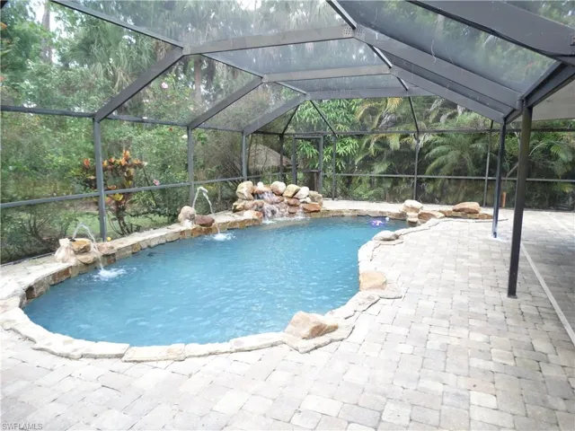 Outdoor lagoon pool with grotto rocks and Fountains!