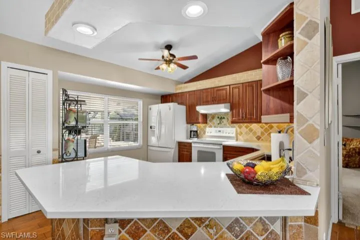 Kitchen featuring NEW Quartz countertops and sink