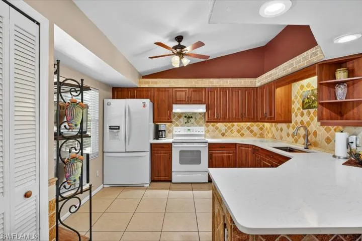 Kitchen featuring NEW Quartz countertops and sink