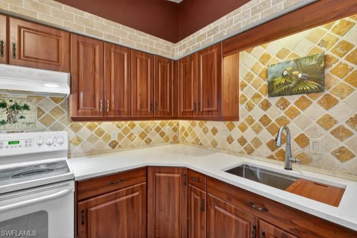 Kitchen featuring NEW Quartz countertops and sink