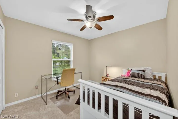 Guest Bedroom 3 with carpet and ceiling fan