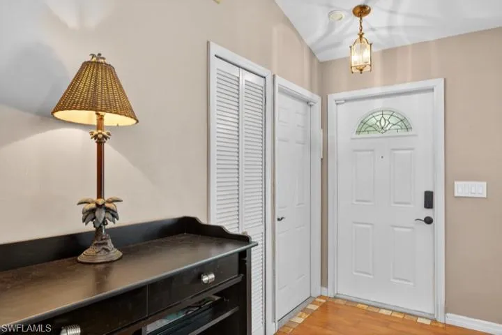 Welcoming Foyer featuring mud-set plank flooring