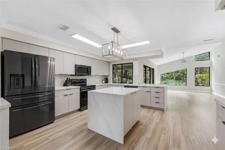 Virtually staged with new cabinets and countertops. Same configuration