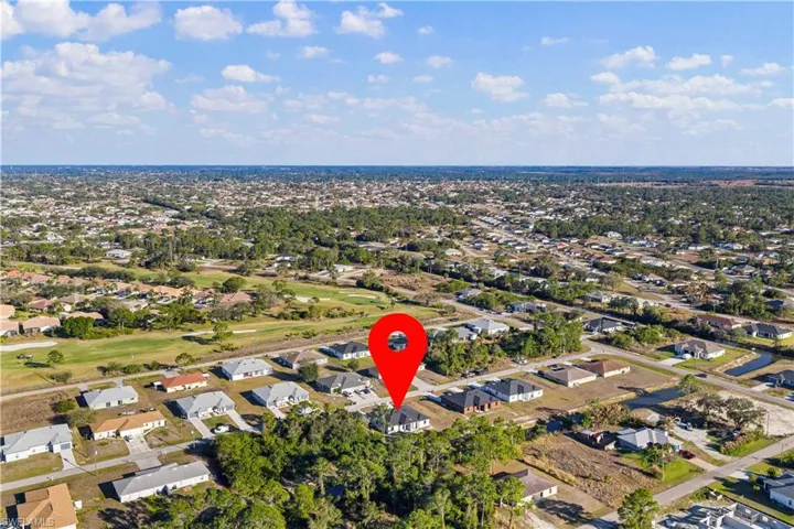 View of property location with nearby suburban area and a golf course