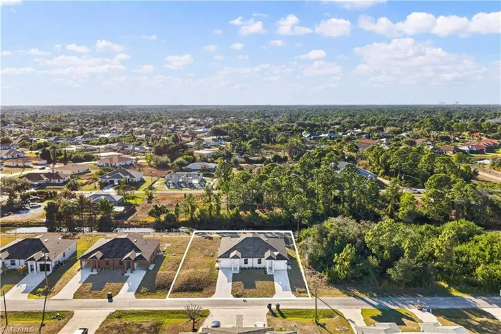 Aerial view of residential area with property parcel outlined