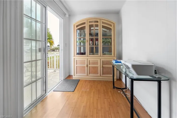 Doorway to outside with wood finished floors