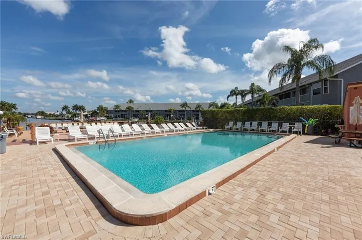 Community pool featuring a patio