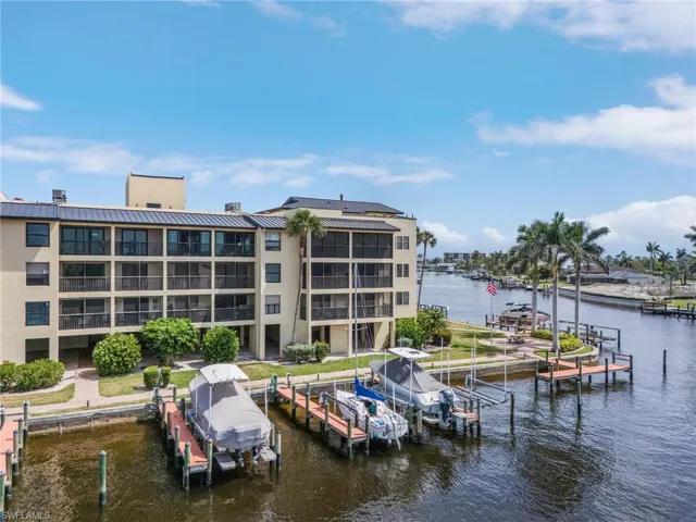 Dock area with a water view and boat lift