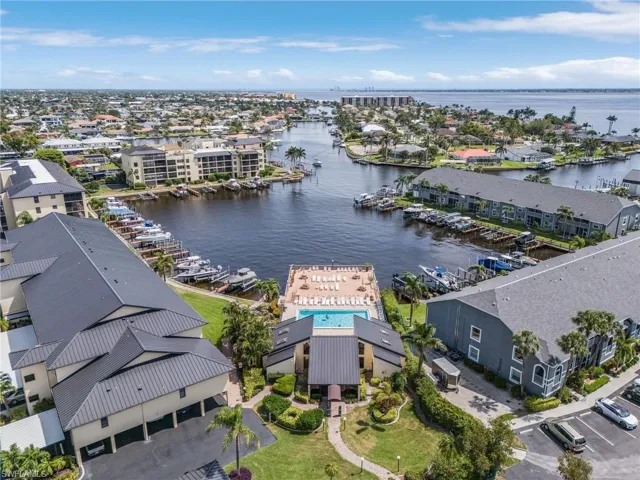 Birds eye view of property featuring a residential view and a water view