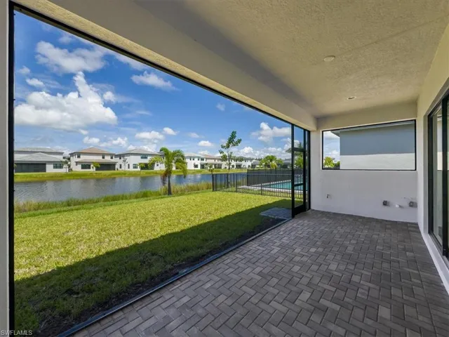 Unfurnished sunroom with a water view