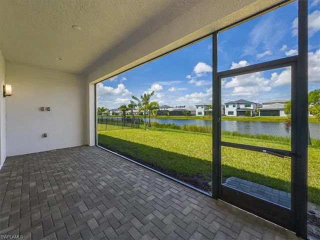 Unfurnished sunroom with a water view