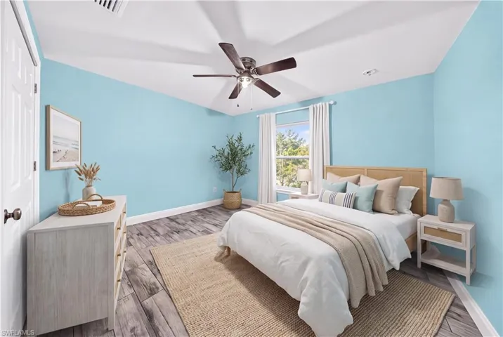 Wood-finish flooring, multi-pane window, and integrated ceiling fan with light fixture
