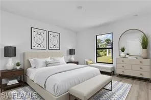 Bedroom with light wood-style floors