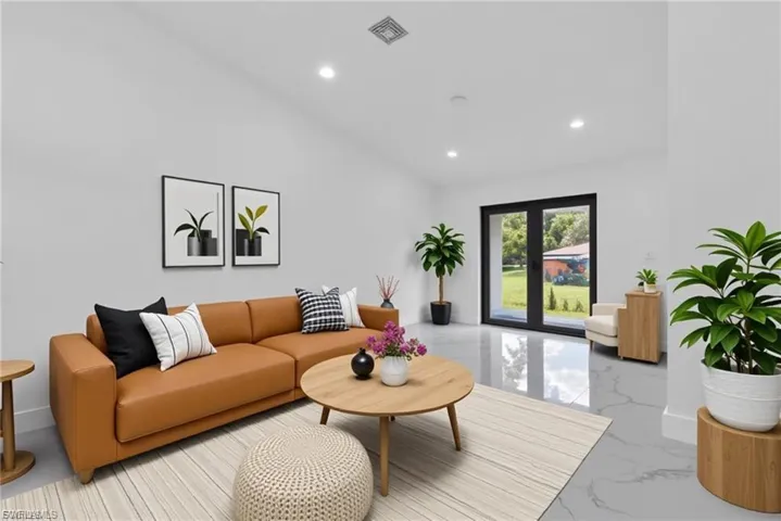 Living room with recessed lighting and marble tiled flooring