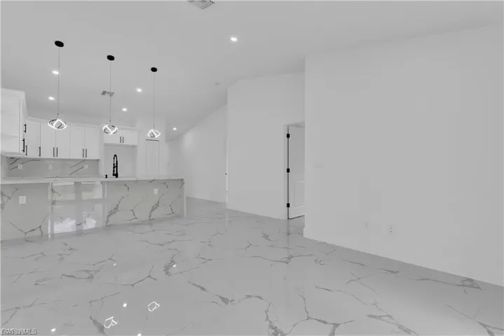 Unfurnished living room with recessed lighting