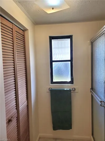 Primary bath has a walk-in closet and shower.