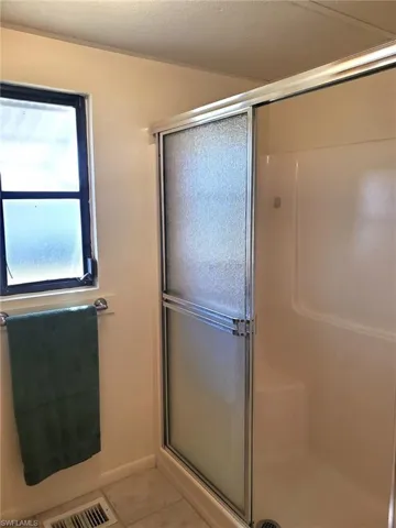 Primary bathroom features a walk-in shower.