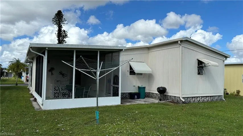 You'll enjoy balmy breezes while relaxing on the screened rear porch.