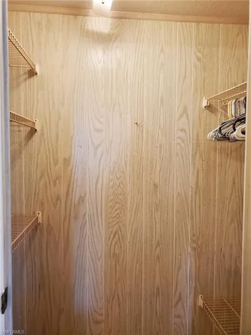 One of two closets in the primary bedroom