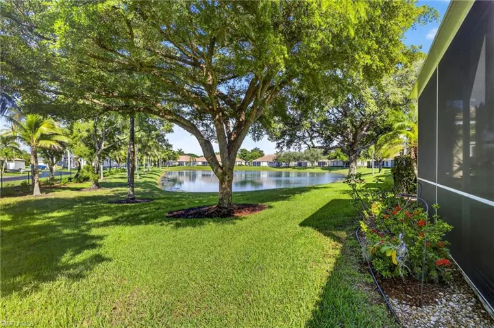 View of backyard with lake view.