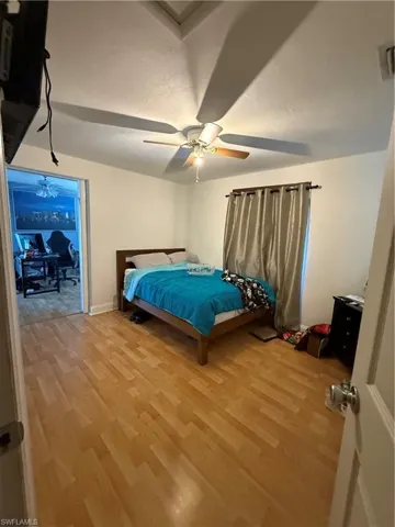 Bedroom featuring light wood-style flooring and ceiling fan
