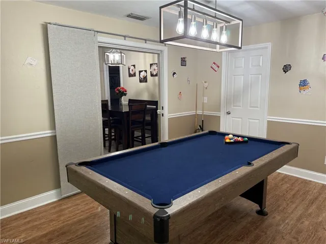 Recreation room featuring pool table and wood finished floors