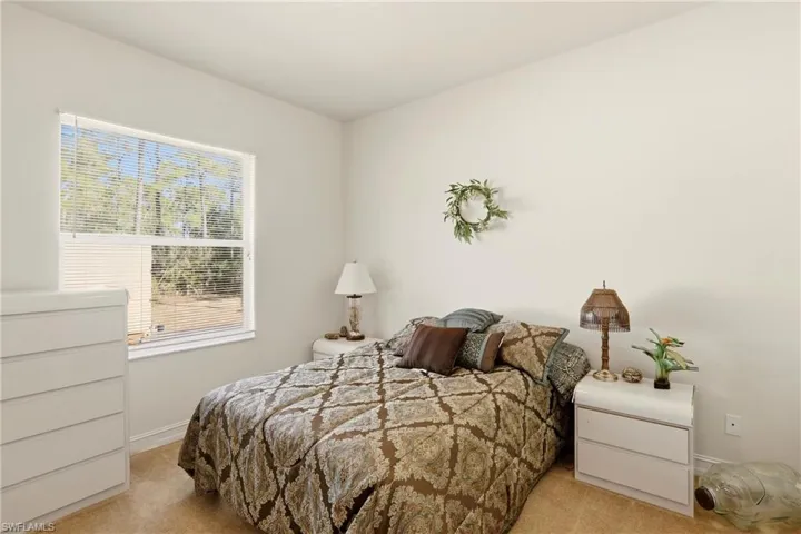 Carpeted bedroom with baseboards