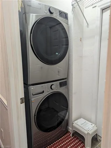 Laundry room 2nd floor with stacked washer and clothes dryer