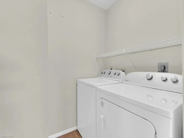 Laundry room featuring washing machine and clothes dryer
