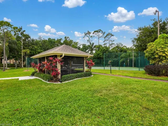View of yard featuring a sunroom