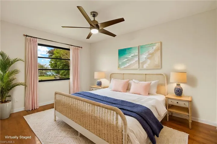 Bedroom featuring wood finished floors and a ceiling fan