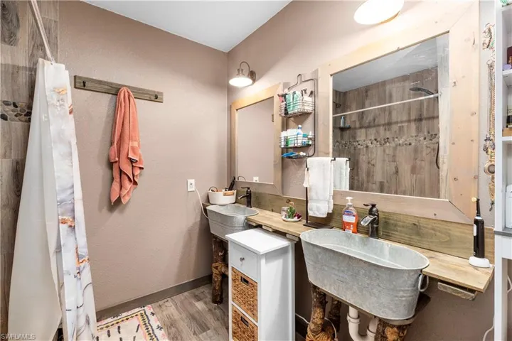 Bathroom featuring vanity and wood-type flooring