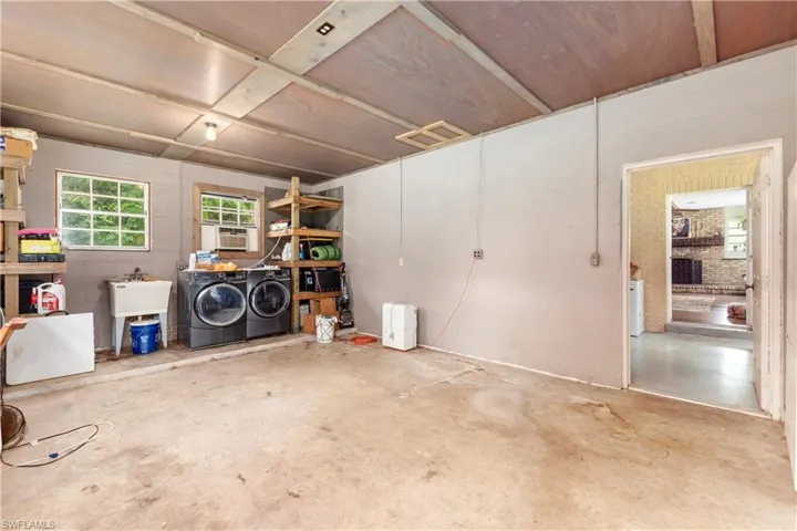 Misc room featuring washing machine and dryer and sink