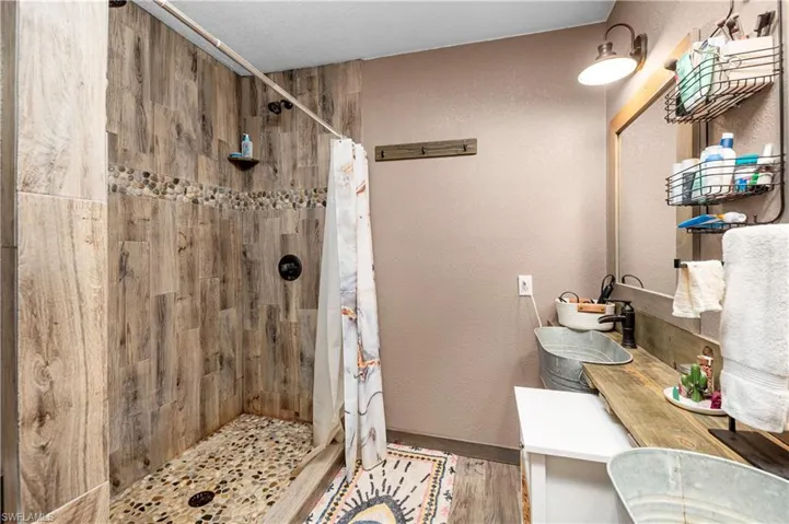 Bathroom featuring vanity and walk in shower