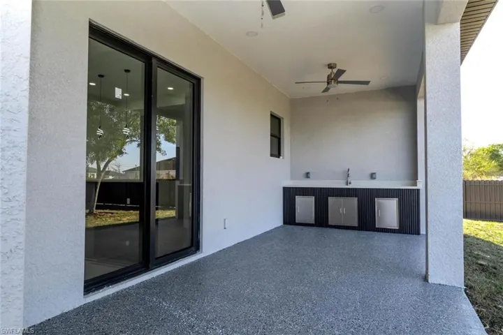 View of patio with a ceiling fan