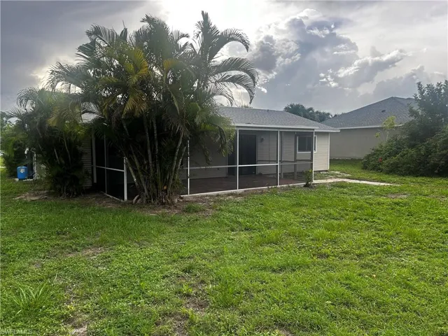 View of yard featuring a sunroom